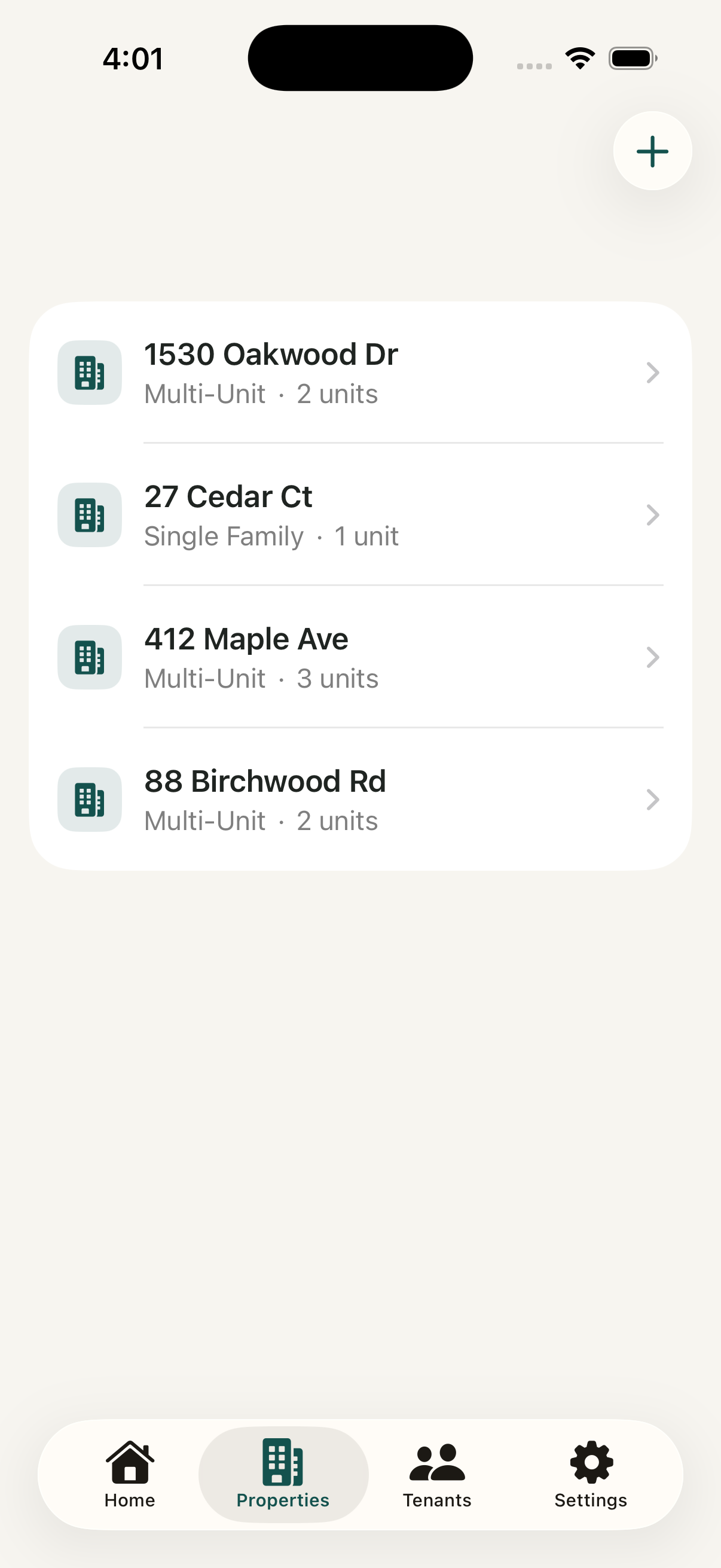 iPhone showing the Properties list with four addresses, each labelled single-family or multi-unit with a unit count.