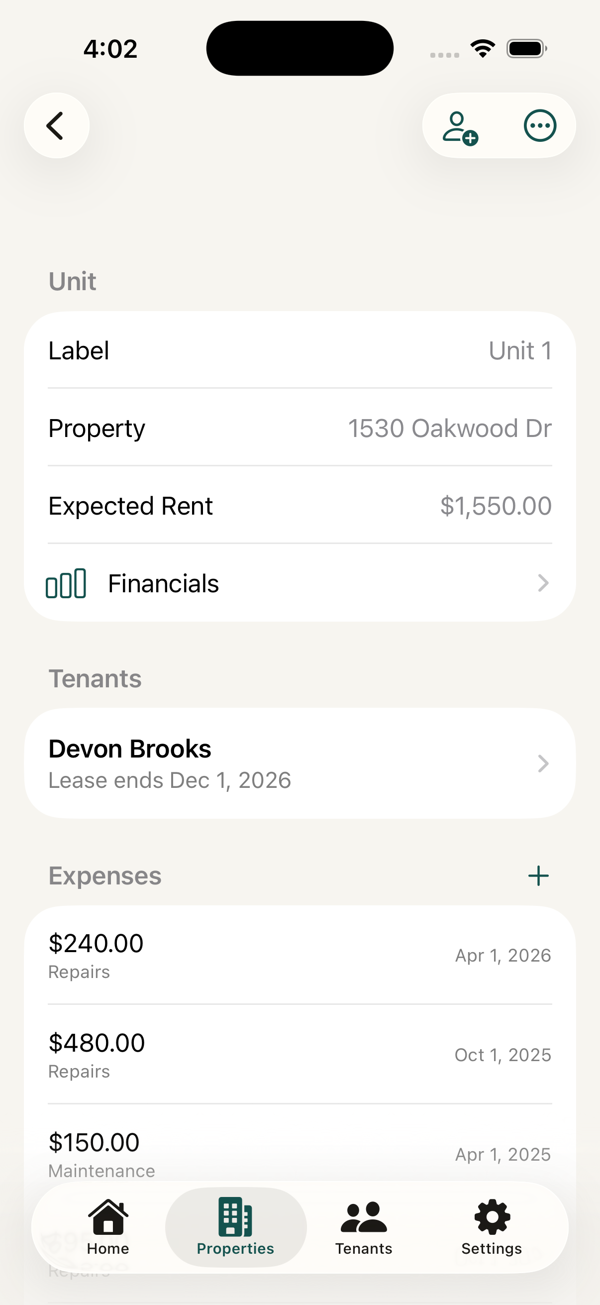 iPhone showing a unit detail screen with label, property, expected rent, the assigned tenant, and a list of recorded expenses.