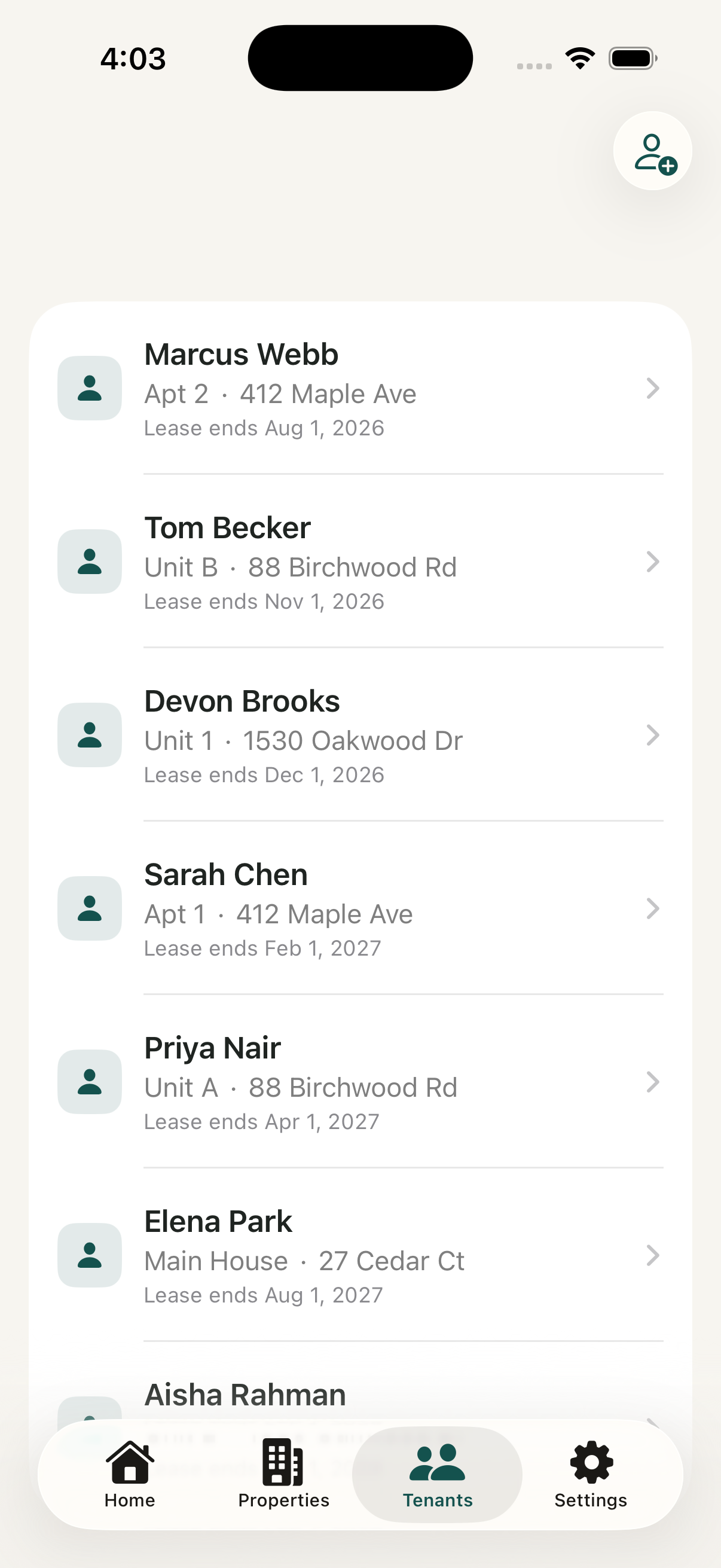 iPhone showing the Tenants list with several tenants, each with their unit, address and lease end date.